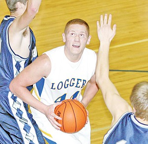&lt;p&gt;Kraig &#147;Coppertop&#148; Nelson, senior center, looks to post up in heavy traffic in the third quarter. Nelson had 10 points and threw his weight around in the close contest.&lt;/p&gt;