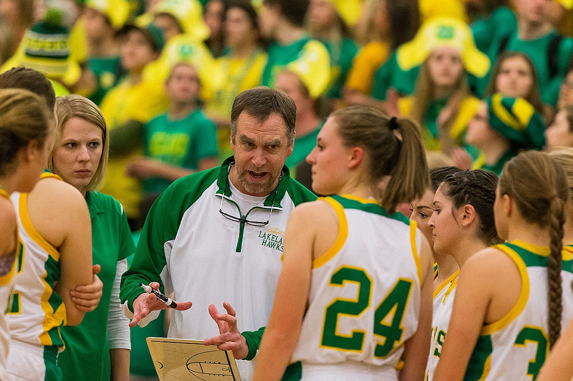 &lt;p&gt;Lakeland girls basketball head coach Steve Seymour huddles with his team during a first half timeout.&lt;/p&gt;
