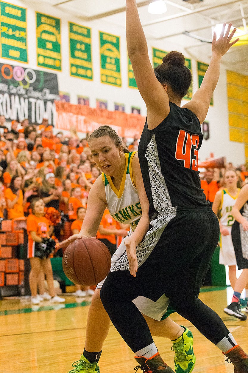 <p>Lakeland Highs Kassadi Bilski makes a move around Post Falls defender AubreAnna Johnson during the first half of the girls game.</p>