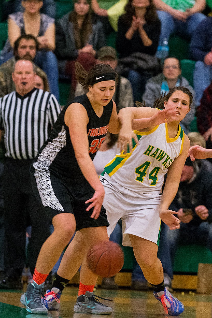 <p>Post Falls Highs Sydney Parks is fouled by Lakeland Highs Dani Dowd in the first quarter.</p>