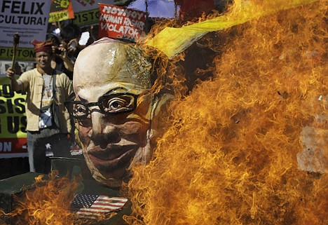 &lt;p&gt;Protesters burn an effigy of Philippine President Benigno Aquino III on board a mock tank as they commemorate International Human Rights Day near the Presidential Palace in Manila, Philippines, on Monday. The group called the Aquino administration as alleged human rights violators.&lt;/p&gt;