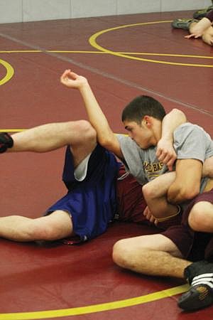 Alan Dale/Columbia Basin Herald&lt;br&gt; Moses Lake wrestler Rico Moreno (right) was back at work Monday following his win at the Bob Mars Invitational two days earlier.