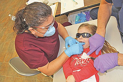 &lt;p&gt;Dental Assistant Victoria Haggard applies tooth sealant to Lily Niblack.&lt;/p&gt;