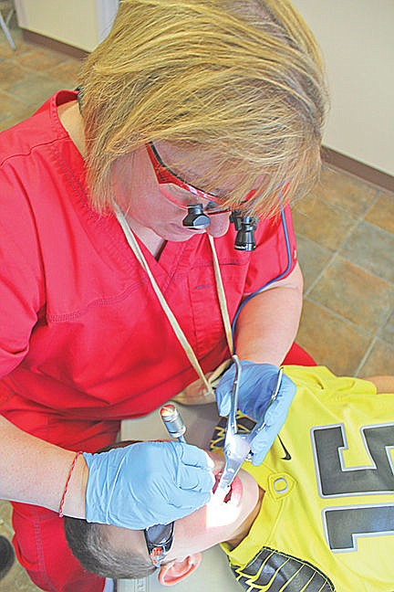 &lt;p&gt;Dental Hygenist Cyndi Marengo applies the sealant to Kenyen, a fourth-grade student in Mrs. Larson's class.&lt;/p&gt;