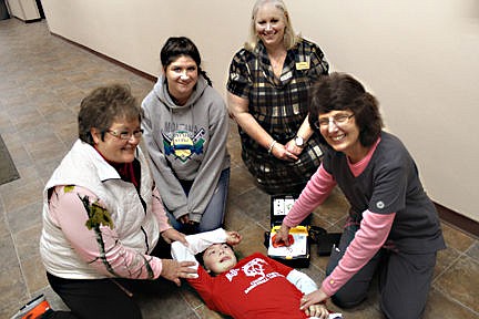 &lt;p&gt;From left to right: Shelley Croft, of Chubby Chicks, Mikayla Croft, cheerleader, K-Ann DeLong and school nurse Millie Nesladek demonstrate the new defibrillator on Ethan McCauley.&lt;/p&gt;&lt;p&gt;&lt;/p&gt;