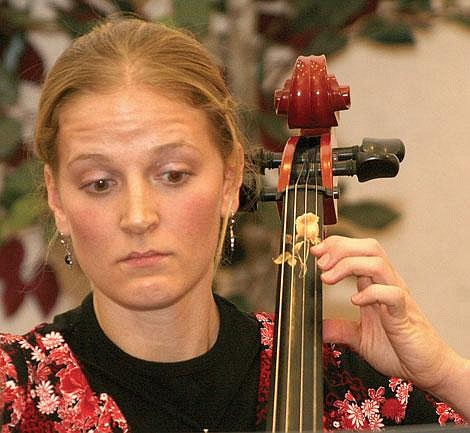 Photo by Aaric Bryan&lt;br&gt;Tamara Williams plays &quot;Heroes of Long Hope,&quot; on the cello at the Community Christmas Program at the Mormon church in Superior Monday, Dec. 3.