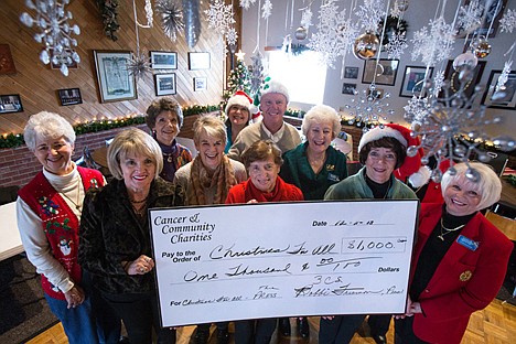 &lt;p&gt;The Cancer and Community Charities donated $1,000 to the Coeur d&#146;Alene Press Christmas For All Wednesday. Pictured front row from left Judy Gardner, Babbi Freeman, Yvonne Hall, Caroline Crollard, Lucille Smith, Sally Cannon, Carol Peterson, back row Marcia Saunders, Cindy Shannon, Mike Patrick and Gwen Letson.&lt;/p&gt;