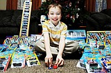 Boy collects toy cars, gives them away