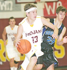 &lt;p&gt;Sophomore guard Gage Tallmadge brings the ball down court with Stillwater's Jeremiah Hashley in tow, fourth quarter.&lt;/p&gt;