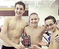 <strong>From left to right:</strong> Luke MacDougall, Eric Kemper and Ian MacDougall celebrate with Kemper's high point winner plaque.