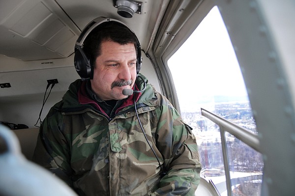 &lt;p&gt;Sheriff's deputy Geno Cook looks out the winder as he and deputy
Rich Shuster take a flight over the Flathead Valley on Monday
afternoon as part of their helicopter traing with the Flathead
Emergency Aviation Resources organization.&lt;/p&gt;