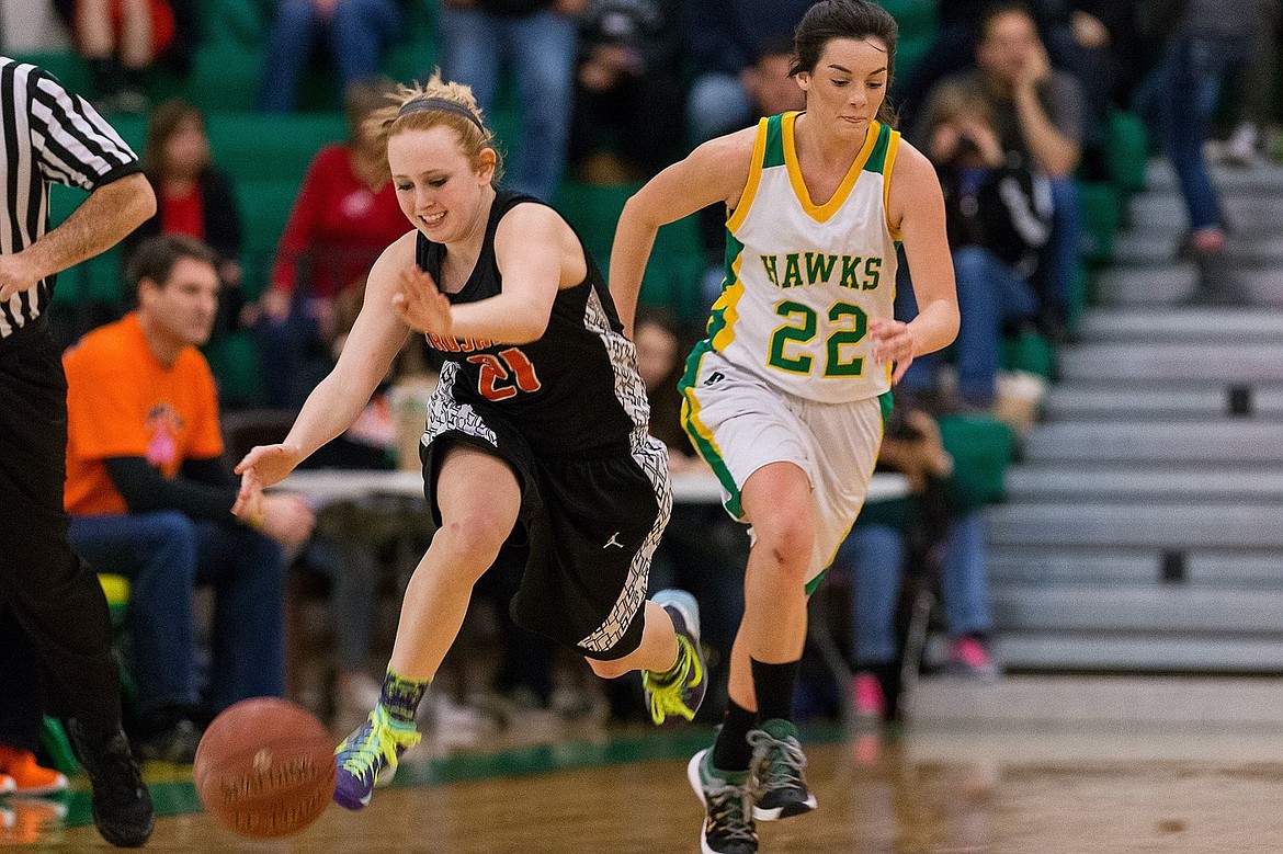 &lt;p&gt;SHAWN GUST/Press Post Falls High School&#146;s Kennady McComb (21) dribbles up the court after stealing the ball from Lakeland&#146;s Faith Bodak (22) during the first quarter of the Prairie Pig Friday in Rathdrum.&lt;/p&gt;