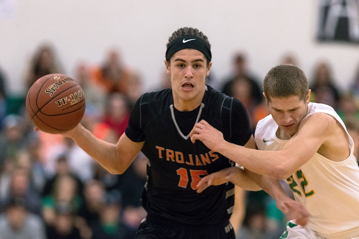 &lt;p&gt;SHAWN GUST/Press Post Falls High School&#146;s Jacob Pfennigs (15) takes the ball up the court as Lakeland&#146;sDan McDevitt defends during the first quarter of the Prairie Pig Friday in Rathdrum.&lt;/p&gt;
