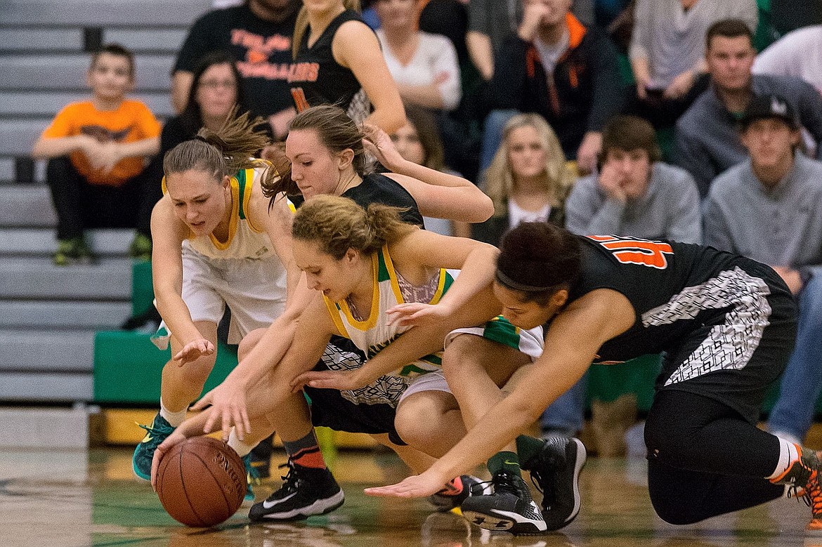 &lt;p&gt;SHAWN GUST/Press From left, Lakeland High&#146;s Tauna Kirk and Brittany Charles battle Post Falls&#146; Glory Ellison and AubreAnna Johnson for a loose ball during the second quarter.&lt;/p&gt;