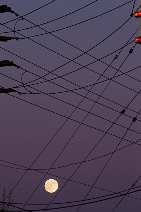 &lt;p&gt;SHAWN GUST/Press Power lines frame the moon at twilight Friday over Coeur d'Alene.&lt;/p&gt;