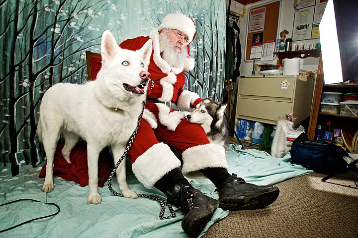 &lt;p&gt;JEROME A. POLLOS/Press Bob Wilson, playing the role of Santa, sits with Sally Klumpe's Siberian Huskies Rocky, left, and Freckles as they wait for their portrait session with Rainbow Photography to begin Thursday at the Kootenai Humane Society Thrift Store in Coeur d'Alene. Pet owners were albe to bring in their animals for a portrait with Saint Nick with proceeds benefiting the Humane Society.&lt;/p&gt;