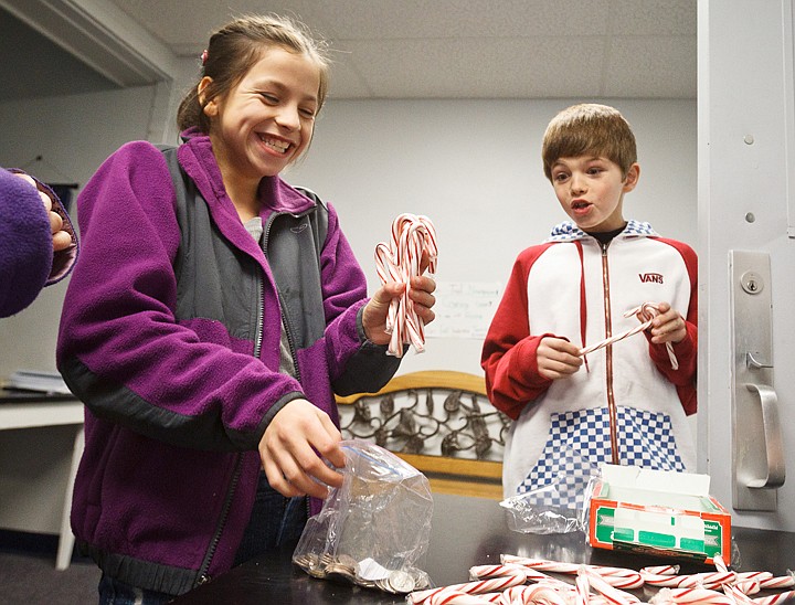 &lt;p&gt;SHAWN GUST/Press Fifth-graders Chandler Roberts, right, reacts after Anneliese Slattery buys a fistful of candy canes Thursday at Mullan Trail Elementary in Post Falls. The fourth grade students are selling candy canes for $.25 each to help benefit Toys for Tots. The sale will continue through December 15.&lt;/p&gt;