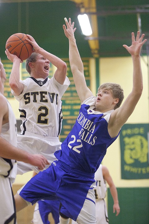 <p>Columbia Falls junior forward Colin Kings (22) falls back while
trying to block a shot by Jared Shultz (2) of Stevensville during
Saturdays Northwest/Southwest Tip-off Tournament at Whitefish High
School.</p>