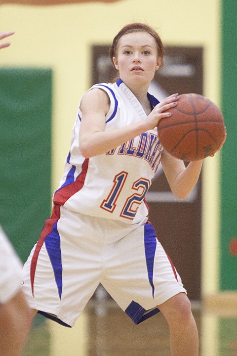 <p>Wildkat junior Tori Price (12) looks to pass the ball during
Columbia Falls' loss to Hamilton in the Tip off Tourney at
Whitefish High School Friday afternoon.</p>
