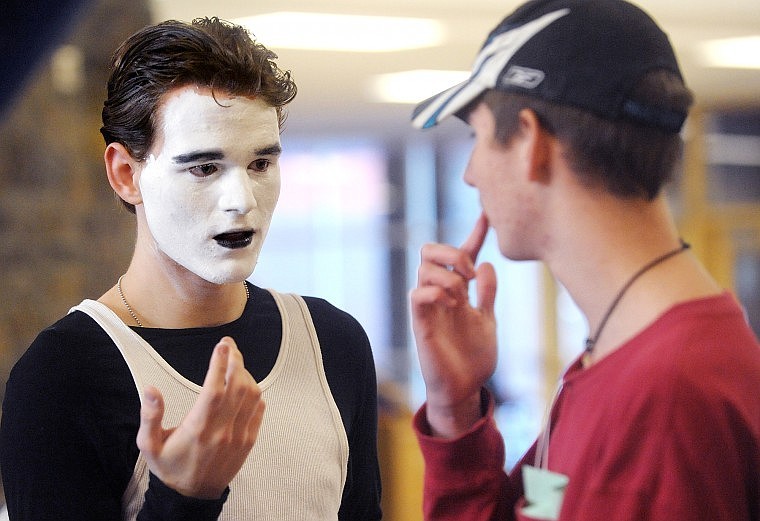 John Vinion, a senior from Libby, left, gets a check on his make-up from fellow Libby senior Mike Wise before the start of round one of the pantomime competition on Friday at Glacier.