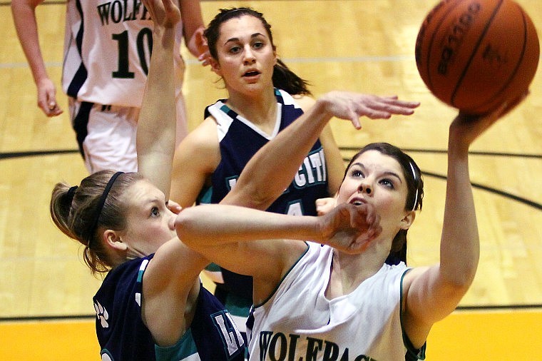 Glacier&#146;s McKell Bennett goes in for a layup while being defended by Lake City&#146;s Sydeney Butler during Friday evening&#146;s game at Flathead High School.