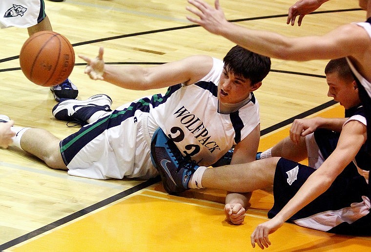 Glacier&#146;s Connor Fuller makes a pass to a teammate after a wild scramble for a loose ball on the court during Friday evening&#146;s nonconference game with Lake City at Flathead High School.