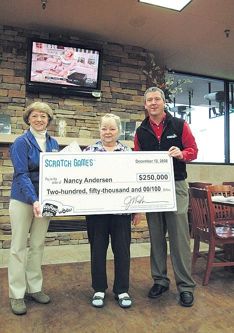 From left, Idaho Lottery regional sales representative Judy Gumm, winner Nancy Andersen and Idaho Lottery commissioner David Keyes. (Photo by CONOR CHRISTOFFERSON)