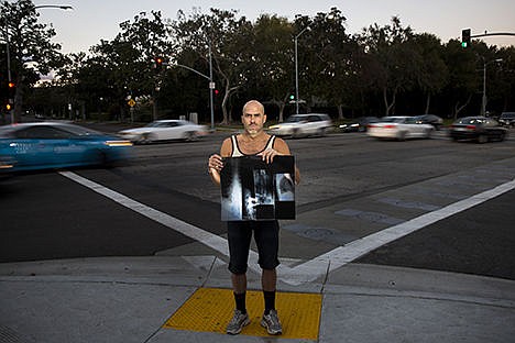 &lt;p&gt;Hit-and-run victim Paul Livingston is photographed Nov. 2 holding his back x-rays at the intersection of Santa Monica Boulevard and North Crescent Drive, where he was struck while riding his bike, in Beverly Hills, Calif.&#160;&lt;/p&gt;