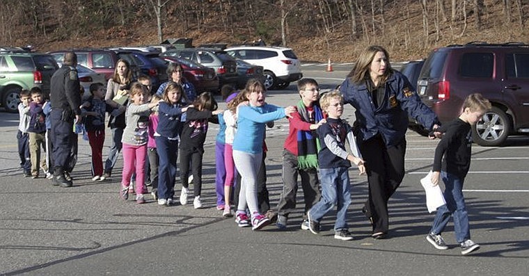 &lt;p&gt;In this photo provided by the Newtown Bee, Connecticut State Police lead children from the school. Twenty-seven people, including 20 children and the shooter, were killed in the second-deadliest school shooting in U.S. history.&lt;/p&gt;