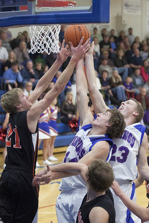 &lt;p&gt;Bigfork's Chris Landon (center) and Connor Coleman (23) battle
Eureka's Tanner Peterson (21) for a rebound during the Vikings' win
at home over the Eureka Lions Thursday night.&lt;/p&gt;