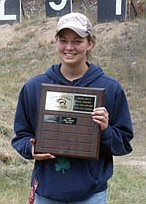 Nicole Hagedorn proudly displays her Montana Rifle and Pistol Association State Long Range High Power Rifle Champion plaque.