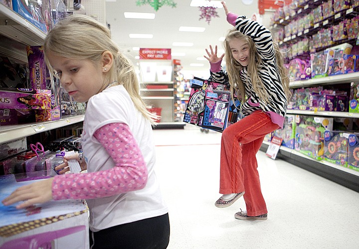 &lt;p&gt;Sophia Smith, right, and Arvilene Pearson react to knocking toys
off the shelf Wednesday afternoon at Target during the ninth annual
Shop with a Cop event.&lt;/p&gt;