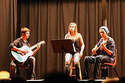 The St. Rejects-Brandyn Jones, Juliana Spencer and Thomas Spencer-perform at the Ski-Snowboarding Club's fundraiser, which was a talent show.