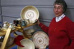 Ellen Childress, creator behind Whistle Creek Pottery, displays some of her work at the Thompson Falls Christmas Bazaar.