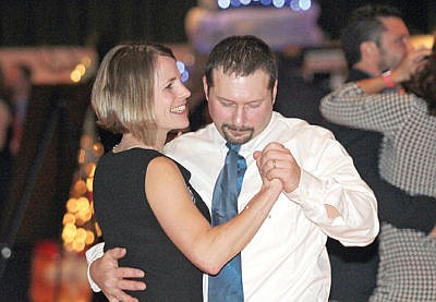 &lt;p&gt;Lori and Neil Benson dance to the music of the Brady Goss Band Saturday during the Festival of Trees Gala 2015.&lt;/p&gt;