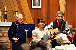 With Patsy Foote on the violin and George Regan on the guitar, Marioel Mattox sings, &quot;Christmas in our Hearts.&quot;