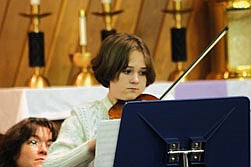 Merlyn Osborne played a duet on the violin with her instructor.
