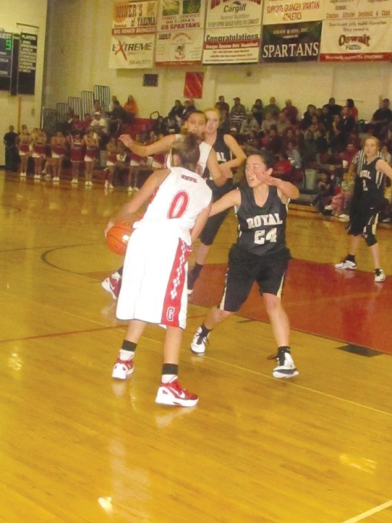 Stefhany Guadarrama, 24, of Royal reacts quickly to cover a
Granger girl near the baseline.