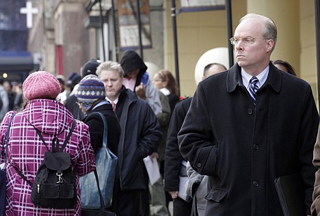 &lt;p&gt;Stephen Rutkowski, a chiropractor from Greenwich, Conn., waits in line Monday to attend a job fair sponsored by National Career Fairs, in New York. The number of people seeking unemployment aid dropped to its lowest level since May 2008 last week, a hopeful sign that layoffs are declining and hiring may pick up.&lt;/p&gt;