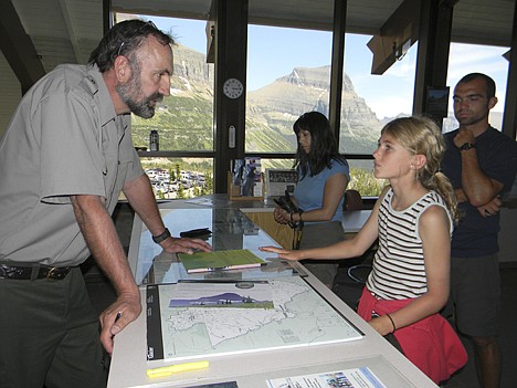 &lt;p&gt;Ranger Larry Mink interacts with a young visitor at Logan Pass in Glacier National Park.&lt;/p&gt;