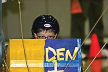 Jamison Romero from the Ronan Weblos Cub Scout Pack 40 gets into position before the start of a race Saturday.