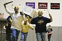 Mission Cub Scout dads, Cheyenne McClure and Bill Brown raced around the track as mighty Vikings during a special event in the annual Chariot races Saturday in Charlo.