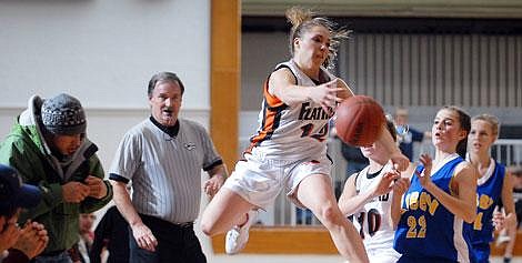 Flathead High School&#146;s Kendalyn Habel saves the ball from going out of bounds during fourth-quarter action against Libby at Flathead on Saturday night. Garrett Cheen/Daily Inter Lake