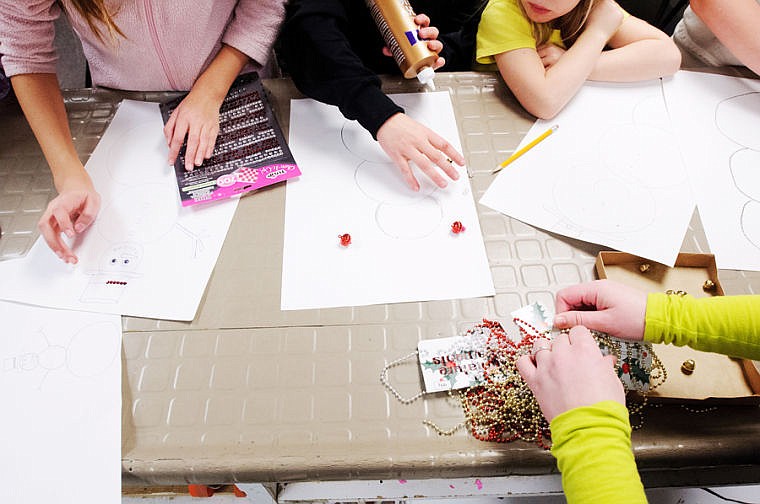 &lt;p&gt;Children decorate snowman drawings at Boys and Girls Club of Glacier Country's Evergreen location.&lt;/p&gt;