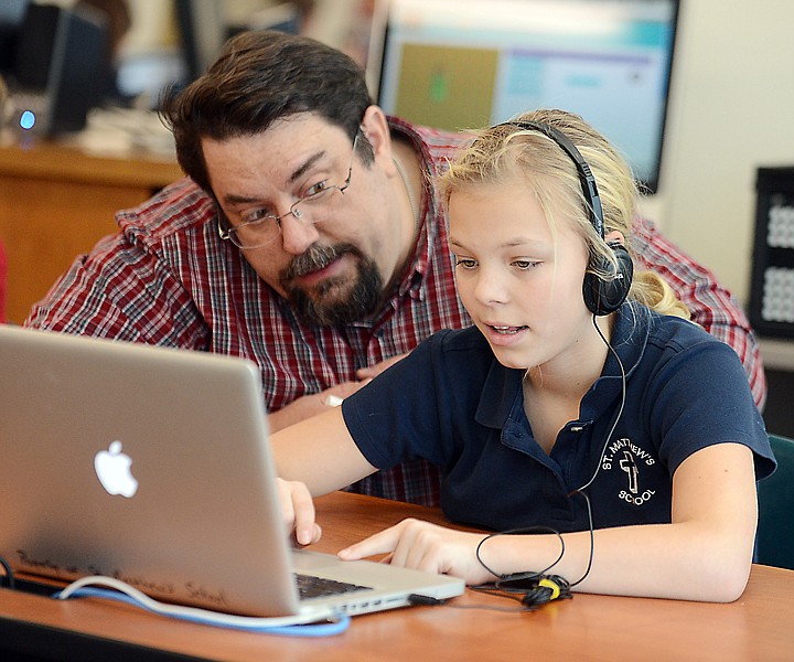 &lt;p&gt;Darren Fix, a computer programmer with Flathead Electric Cooperative, works with Madison Hammett, a sixth-grader at St. Matthew&#146;s School, during the Hour of Code on Thursday.&lt;/p&gt;