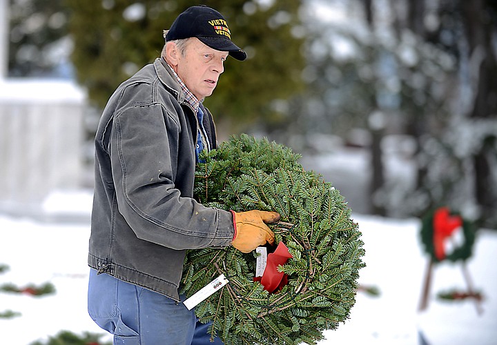 &lt;p&gt;Rob Hedstrom of Columbia Falls carries wreaths to lay on the graves of veterans on Friday afternoon, December 13, at the Conrad Memorial Cemetery in Kalispell. (Brenda Ahearn/Daily Inter Lake)&lt;/p&gt;