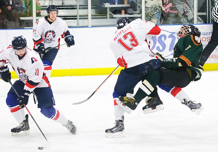 &lt;p&gt;Great Falls Americans defenseman Donovan Mattfeldt (13) checks Glacier Nationals defenseman Corbin Emery (right) Thursday night in the second period of an American West Hockey League game at the Stumptown Ice Den in Whitefish.&lt;/p&gt;