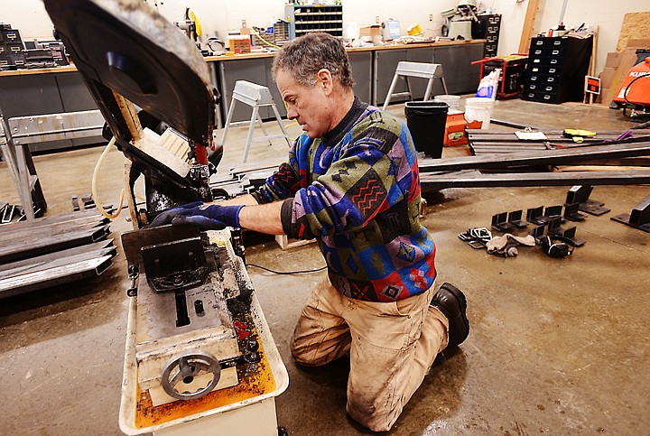 &lt;p&gt;Julian Cunningham, campus farm manager at Flathead Valley Community College, cuts steel bars for the agricultural program&#146;s new greenhouse on Dec. 10. Cunningham hopes to have the structure up by the first week of January and to have the greenhouse enclosed and ready for the students by the first of the semester.&lt;/p&gt;