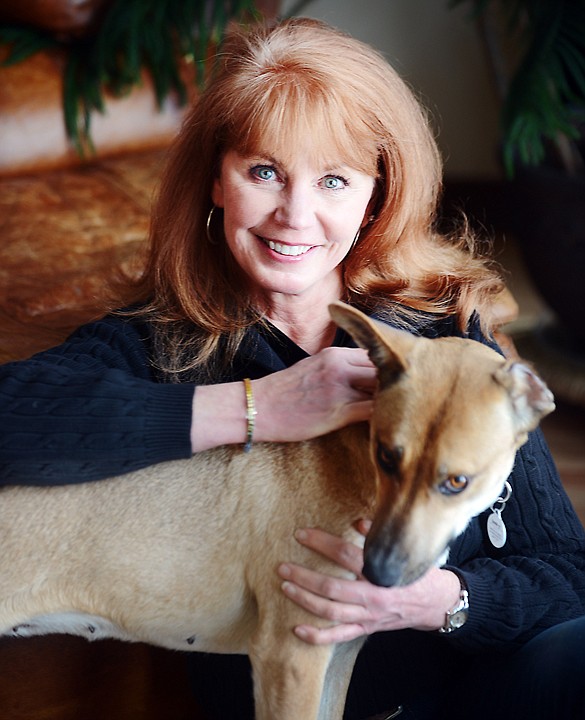 &lt;p&gt;Jerri Swenson poses at her Whitefish home with one of the dogs she rescued from Browning. (Brenda Ahearn/Daily Inter Lake)&lt;/p&gt;