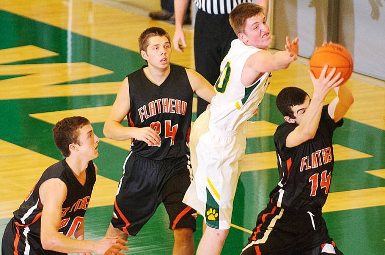 &lt;p&gt;Flathead's Tommie Owens grabs a rebound underneath the Whitefish basket Tuesday night during Flathead's victory over Whitefish at Whitefish High School. Dec. 10, 2013 in Whitefish, Montana. (Patrick Cote/Daily Inter Lake)&lt;/p&gt;